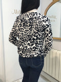 Sweater in light stone and black with leopard design