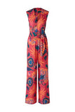 Cerise sleeveless jumpsuit with orange and green print and front tie belt