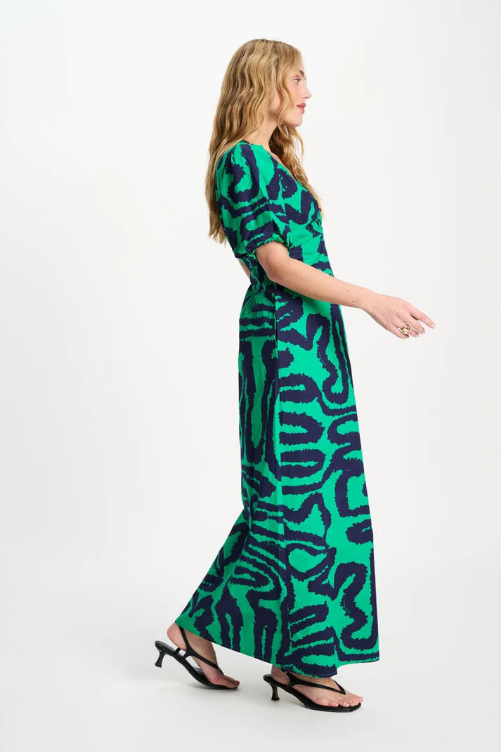 Long v-neck dress in green with blue waves print
