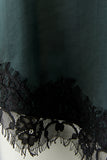 Forest green spaghetti strap camisole with black lace trim
