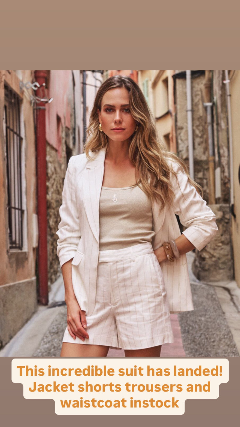 Off white wide leg trousers in linen mix with camel pinstripe