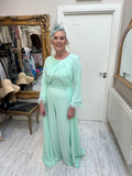 Mint jumpsuit with feather trim