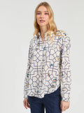 White shirt with geometric print in navy and fun motif all over.