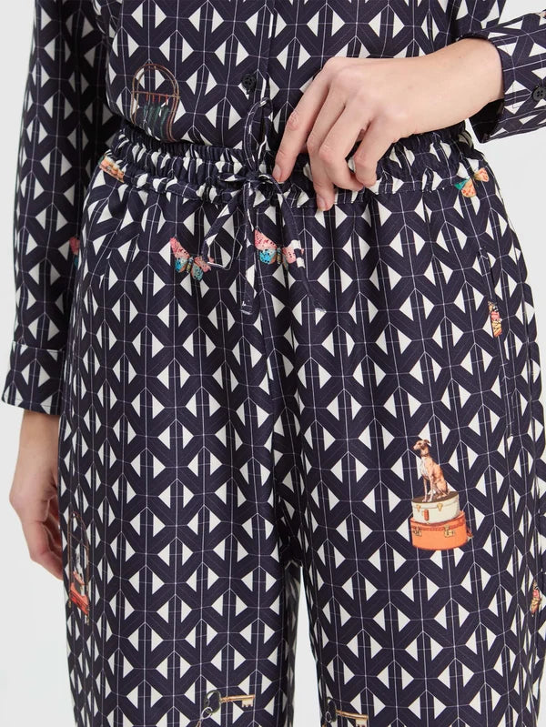 Straight leg trousers with geometric print on navy background