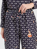Straight leg trousers with geometric print on navy background