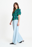 V neck top in green waves pattern