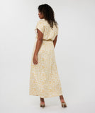 White and camel maxi dress in electric print with gold belt