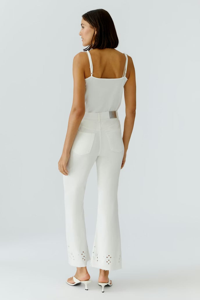 Cropped summer jeans with elaborate embroidery at the hemline