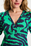 Long v-neck dress in green with blue waves print