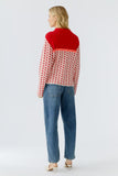 Red and cream Sweater with lip jacquard.