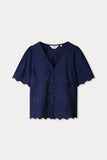 Dark blue blouse with palm tree pattern and a scalloped hem