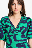 V neck top in green waves pattern
