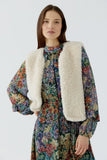 Cosy knitted vest in ecru fur look
