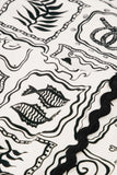 Wrap effect skirt in black and cosy white with nautical pattern and braiding