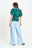 V neck top in green waves pattern