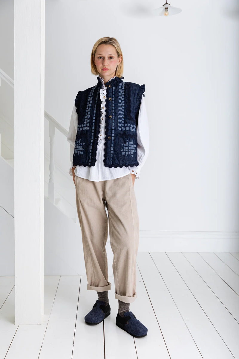 Denim gilet with frill collar and embroidery in blue