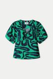 V neck top in green waves pattern