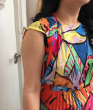Multicoloured dress with pleated skirt