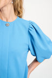 Light blue top with round neck and puff sleeves