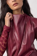 Berry red soft pleather sleeveless.