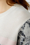 Knitted sweater in snake print, nude and peach whip