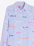 Light blue and white striped shirt with embroidered words