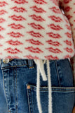 Cuddly sweater with all over lip motif
