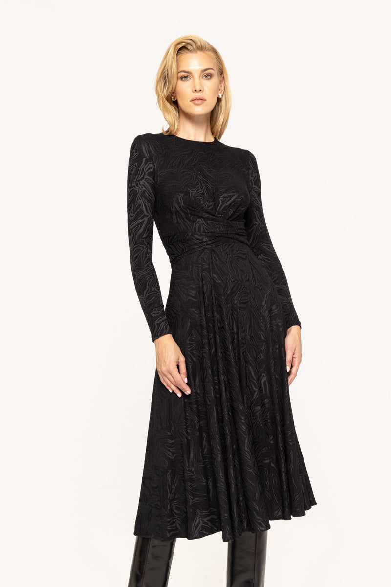 Black jersey dress. With swirl pattern