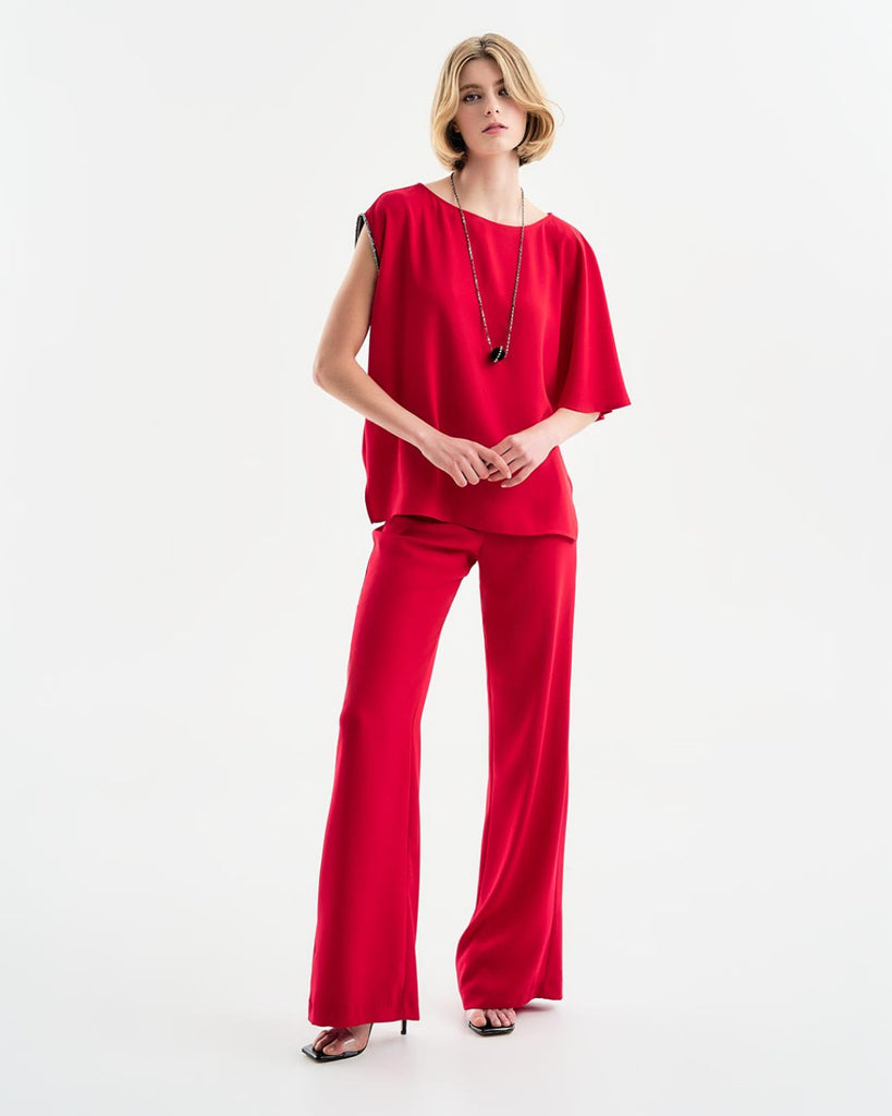 Red crepe trousers with rhinestone belt