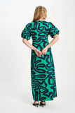 Long v-neck dress in green with blue waves print
