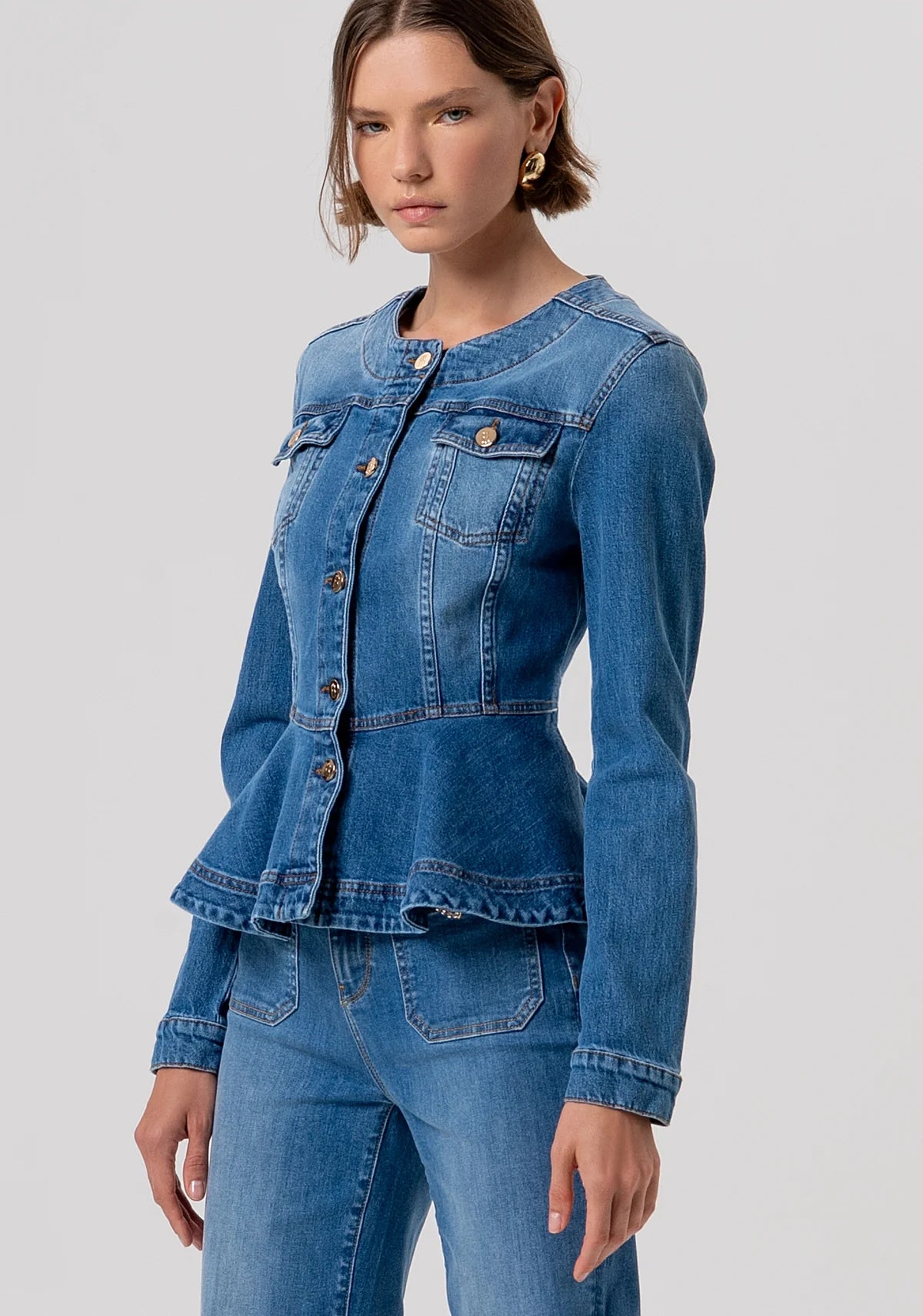 Denim jacket with peplum and gold buttons