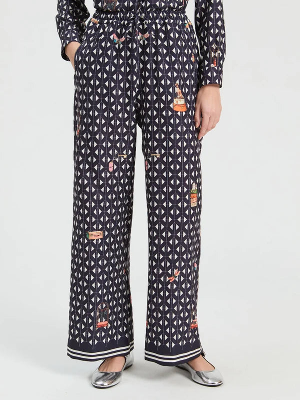 Straight leg trousers with geometric print on navy background