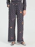 Straight leg trousers with geometric print on navy background