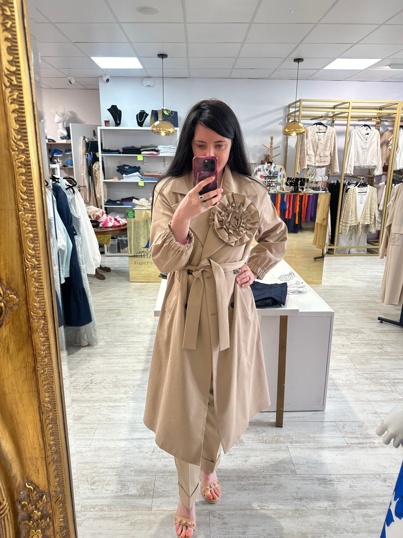 Double breasted trench coat in camel with rosette