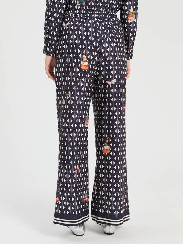 Straight leg trousers with geometric print on navy background