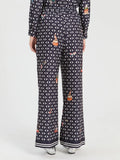 Straight leg trousers with geometric print on navy background
