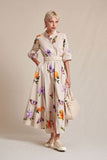 Tiered dress in beige with flowers and butterfly pattern