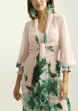 Pink dress with green print tied at the waist