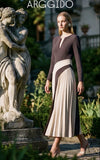 Bicolour pleated dress in black and cream