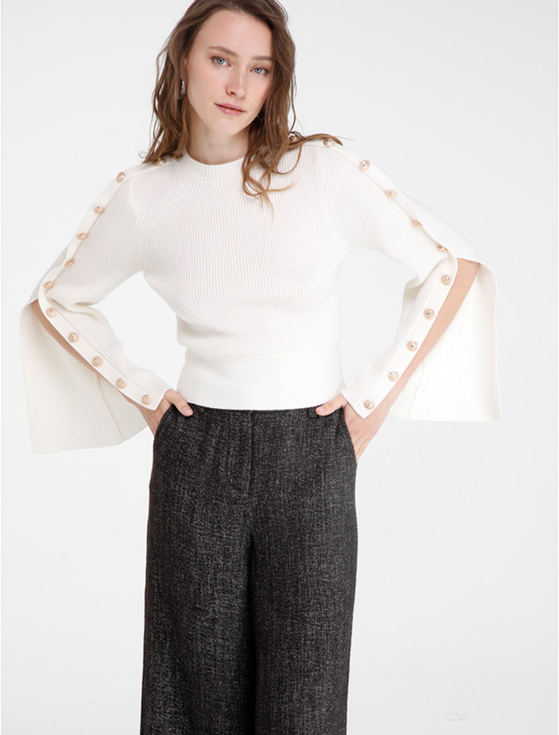 Round neck knit with exaggerated sleeves with buttons detail