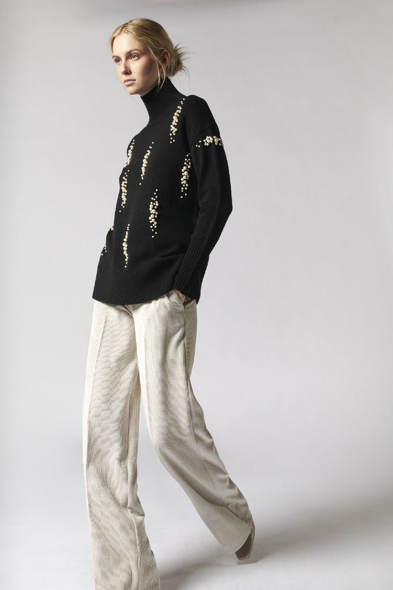 Black sweater with pearl design