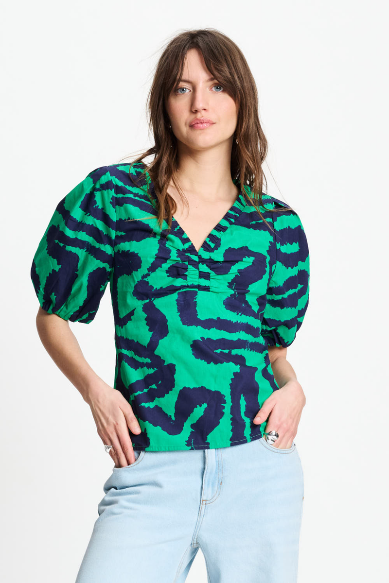 V neck top in green waves pattern