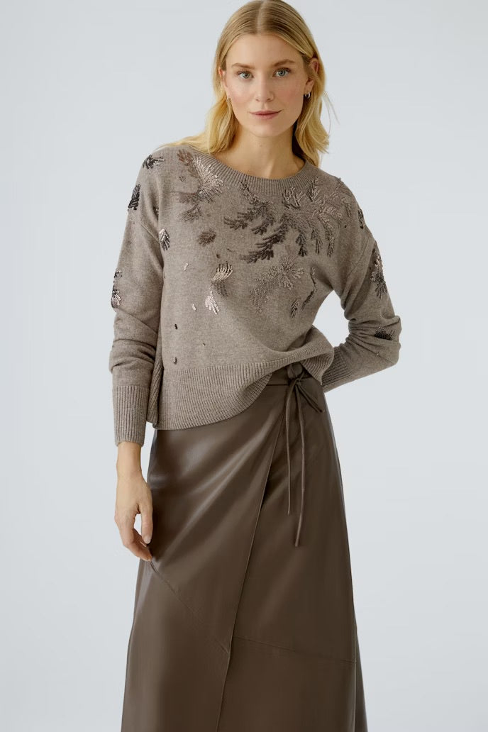 Plain knit sweater with sequin motifs