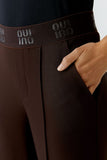 Chocolate ganache coloured fitted trousers in a technical stretch fabric