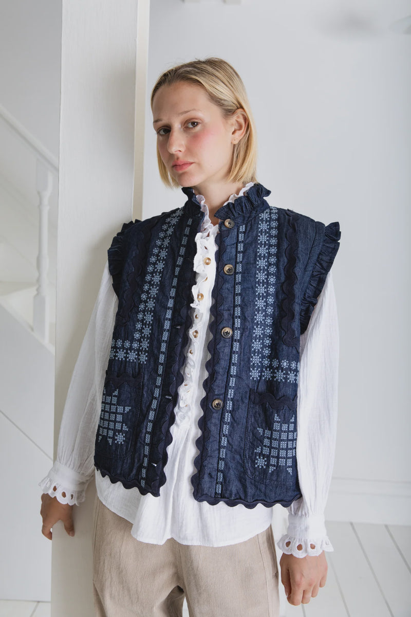 Denim gilet with frill collar and embroidery in blue