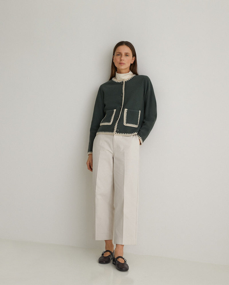 Boiled wool cardigan in green with cream trim