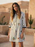 White tunic dress with green vertical stripes and animal print