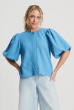 Light blue top with round neck and puff sleeves