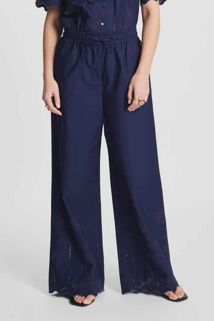 Dark blue trousers in Broderie Anglaise
