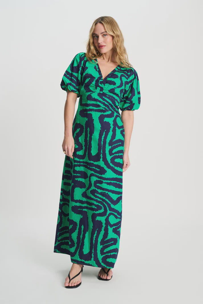 Long v-neck dress in green with blue waves print